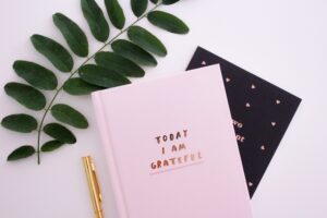 Gratitude diaries on a desk, pens, practising gratitude, complete harmony, sharon taylor